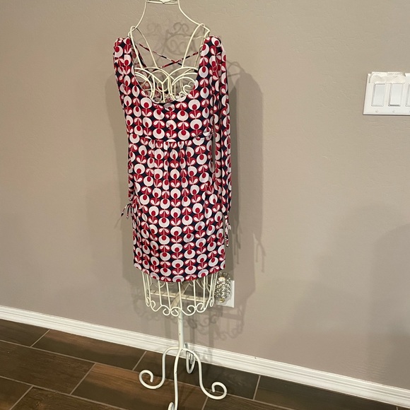 Two blouses identical pattern. Four buttons down the front. - Picture 1 of 7